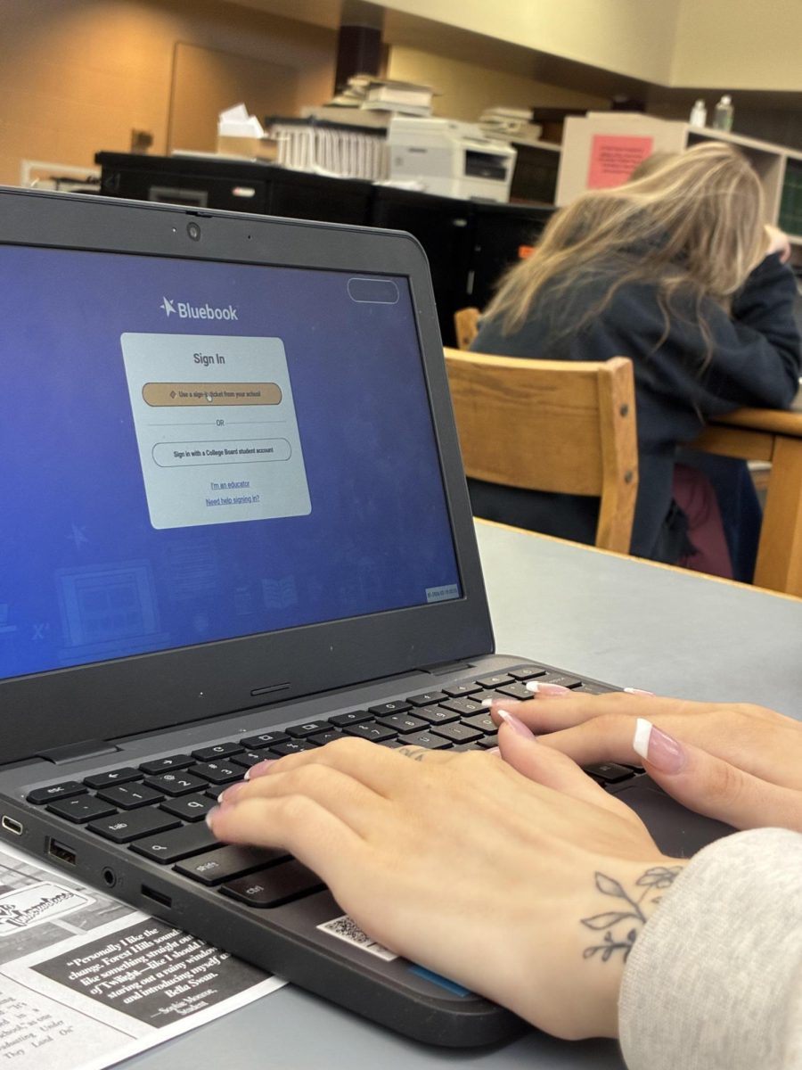 Student uses bluebook to take practice tests for SAT.